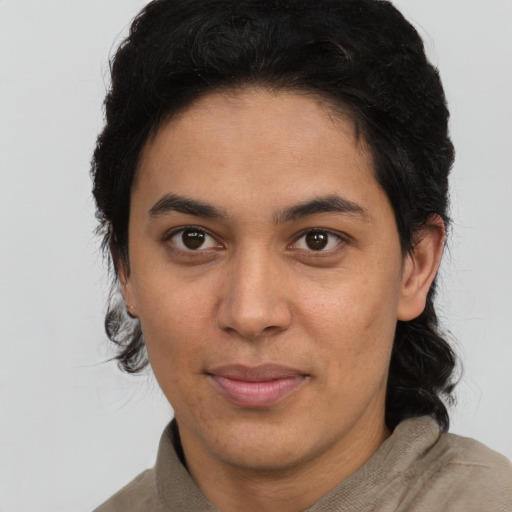 Joyful latino young-adult female with short  brown hair and brown eyes