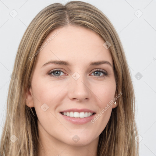 Joyful white young-adult female with long  brown hair and green eyes