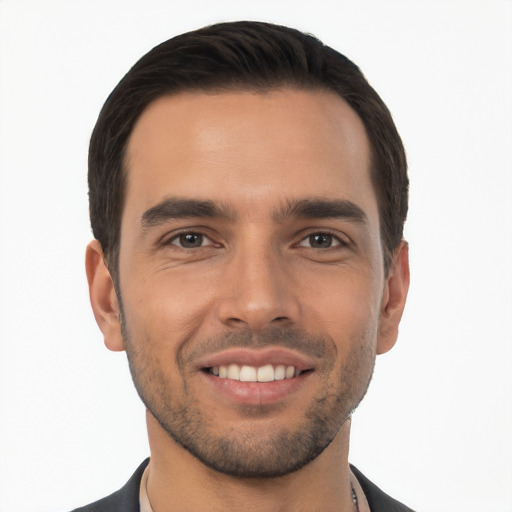 Joyful white young-adult male with short  black hair and brown eyes