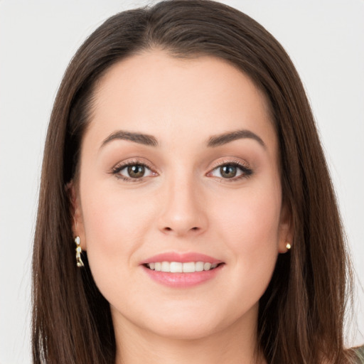 Joyful white young-adult female with long  brown hair and grey eyes