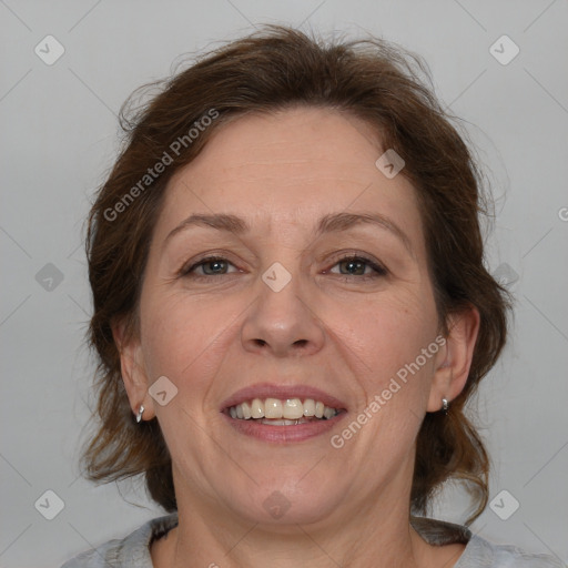 Joyful white adult female with medium  brown hair and grey eyes