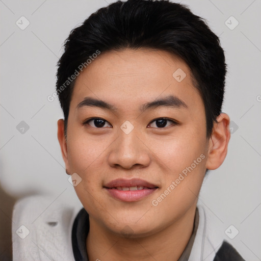 Joyful asian young-adult male with short  black hair and brown eyes