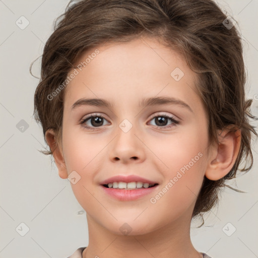 Joyful white child female with medium  brown hair and brown eyes