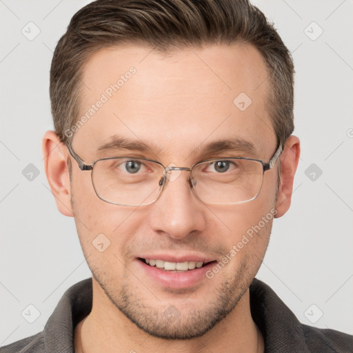 Joyful white adult male with short  brown hair and grey eyes