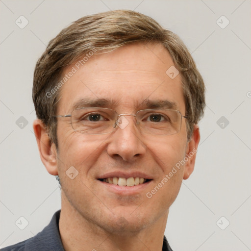 Joyful white adult male with short  brown hair and grey eyes