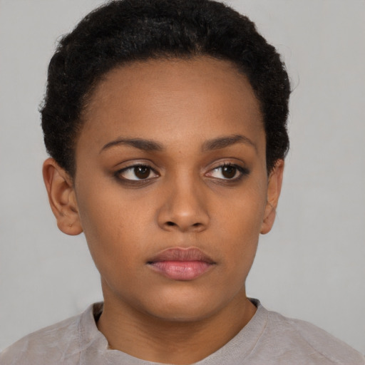 Neutral black young-adult female with short  brown hair and brown eyes