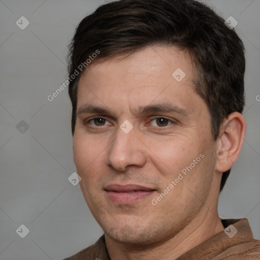 Joyful white adult male with short  brown hair and brown eyes