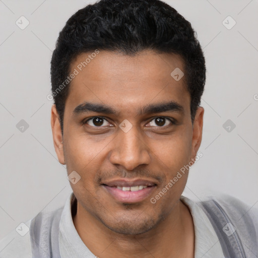 Joyful latino young-adult male with short  black hair and brown eyes