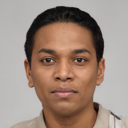 Neutral latino young-adult male with short  black hair and brown eyes