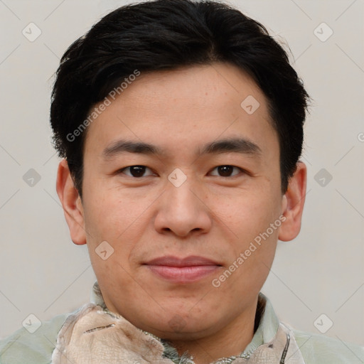 Joyful asian young-adult male with short  brown hair and brown eyes