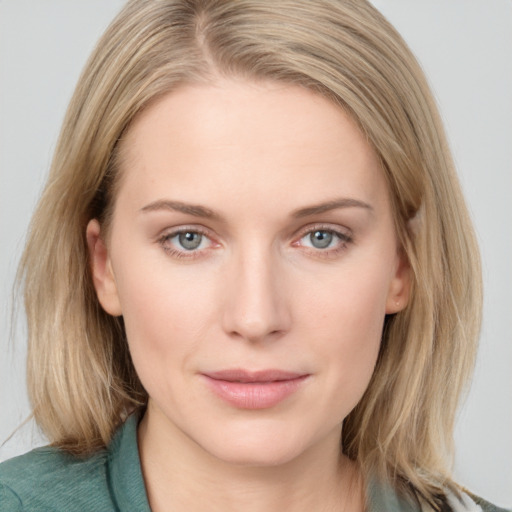 Joyful white young-adult female with medium  brown hair and blue eyes