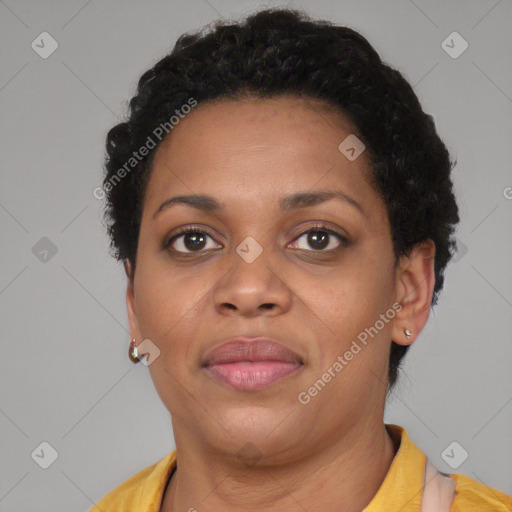 Joyful black young-adult female with short  brown hair and brown eyes