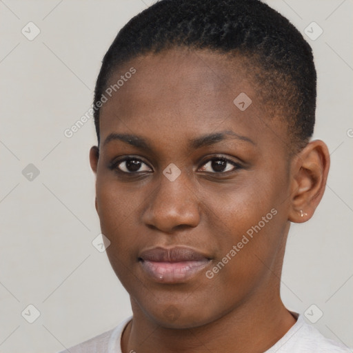 Joyful black young-adult female with short  brown hair and brown eyes