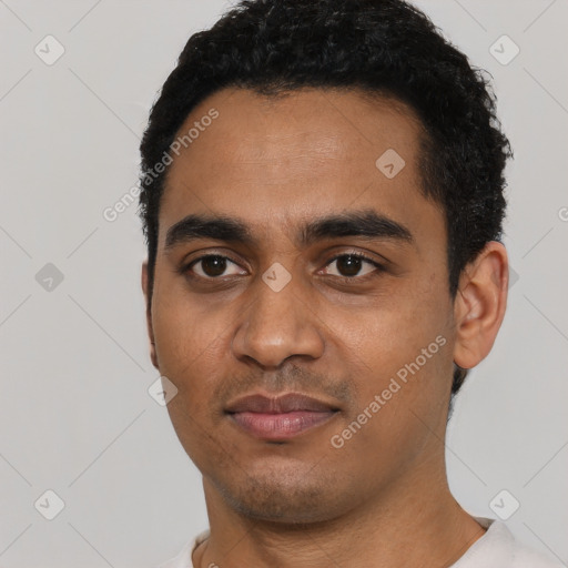 Neutral latino young-adult male with short  black hair and brown eyes