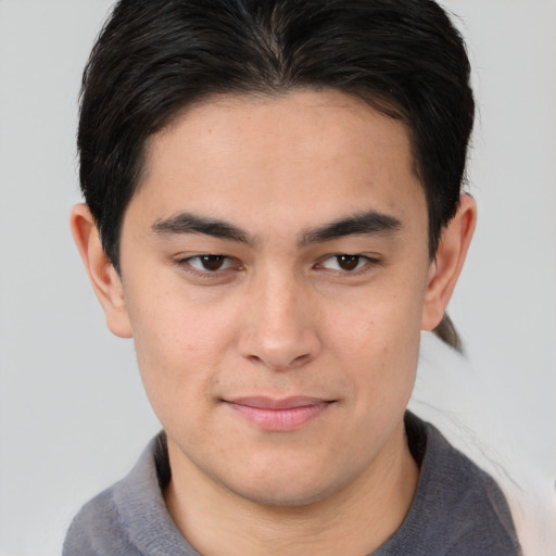 Joyful white young-adult male with medium  brown hair and brown eyes