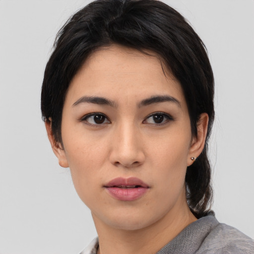 Neutral asian young-adult female with medium  black hair and brown eyes