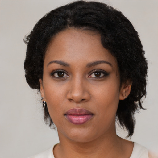 Neutral black young-adult female with medium  black hair and brown eyes