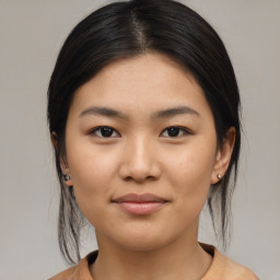 Joyful asian young-adult female with medium  brown hair and brown eyes