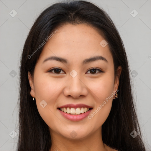 Joyful asian young-adult female with long  brown hair and brown eyes