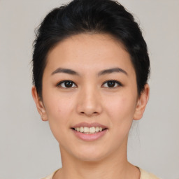 Joyful asian young-adult female with short  brown hair and brown eyes