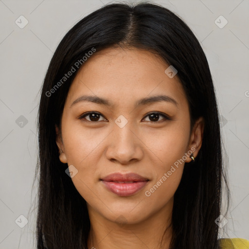 Joyful latino young-adult female with long  brown hair and brown eyes