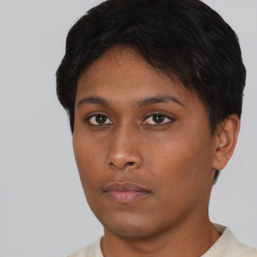 Neutral black young-adult female with short  brown hair and brown eyes