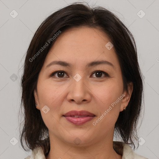 Joyful white adult female with medium  brown hair and brown eyes