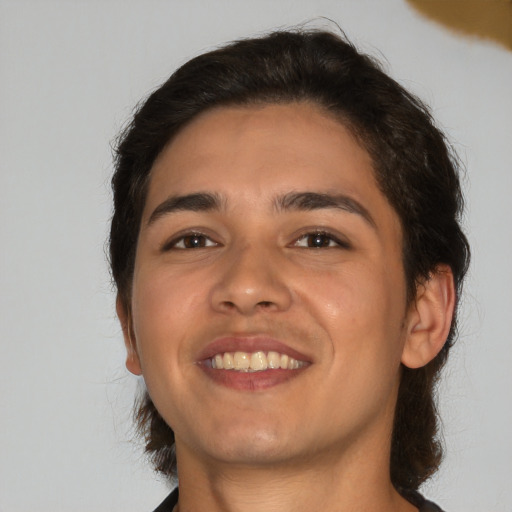 Joyful white young-adult male with medium  brown hair and brown eyes