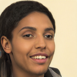 Joyful latino young-adult female with long  brown hair and brown eyes