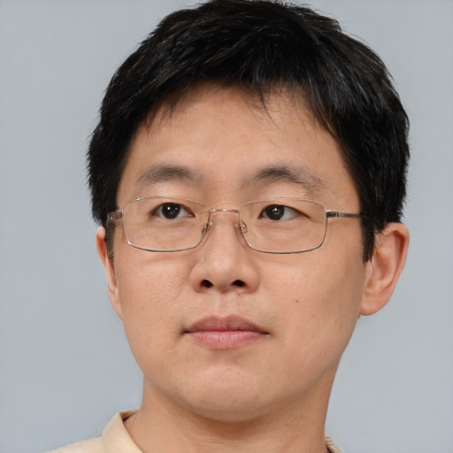 Neutral asian adult male with short  brown hair and brown eyes