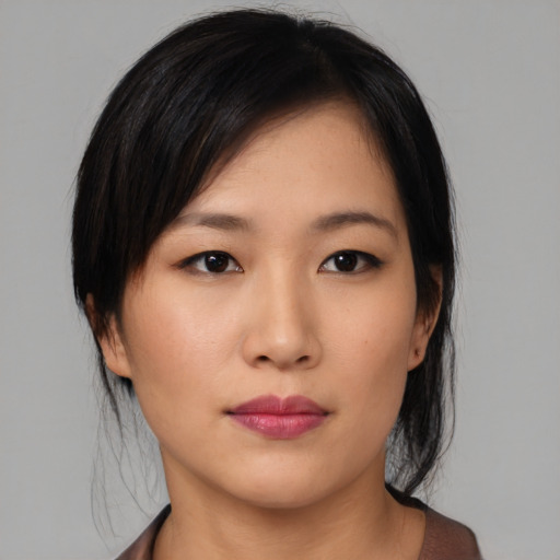Neutral asian young-adult female with medium  black hair and brown eyes