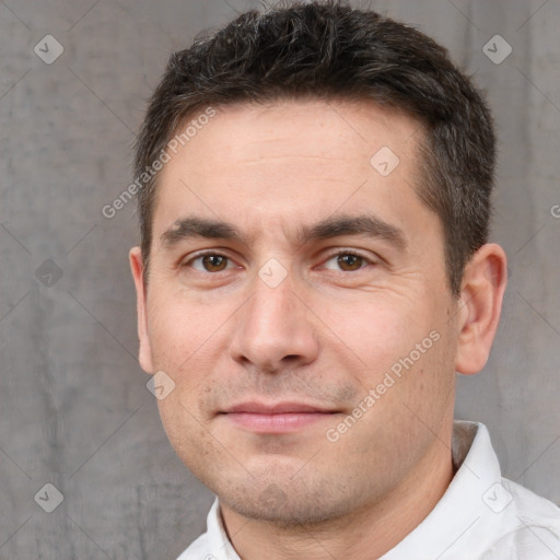 Joyful white adult male with short  brown hair and brown eyes