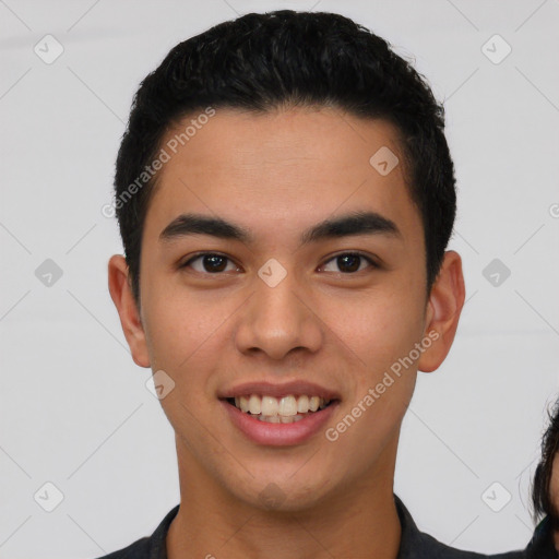 Joyful white young-adult male with short  black hair and brown eyes