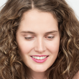 Joyful white young-adult female with long  brown hair and green eyes