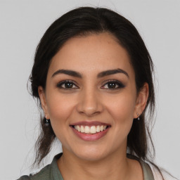 Joyful white young-adult female with medium  brown hair and brown eyes