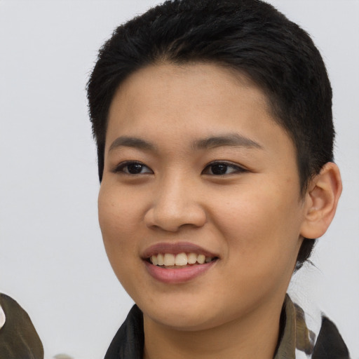 Joyful asian young-adult female with short  black hair and brown eyes