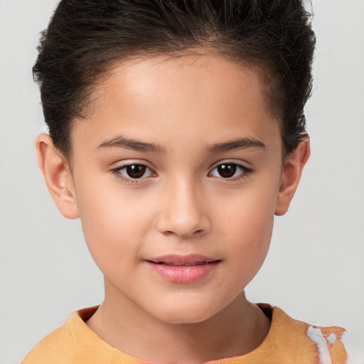 Joyful white child female with short  brown hair and brown eyes