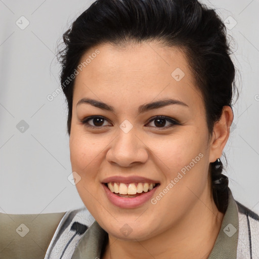 Joyful latino young-adult female with medium  brown hair and brown eyes