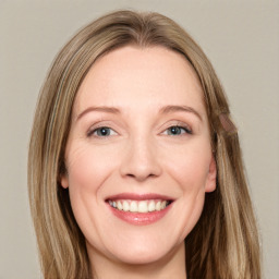 Joyful white young-adult female with long  brown hair and green eyes