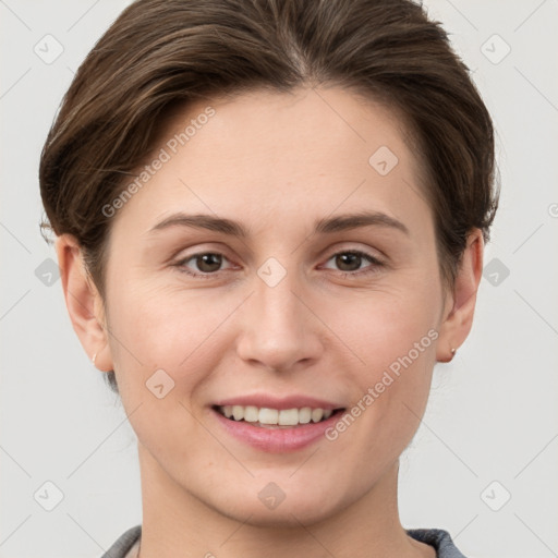 Joyful white young-adult female with short  brown hair and grey eyes