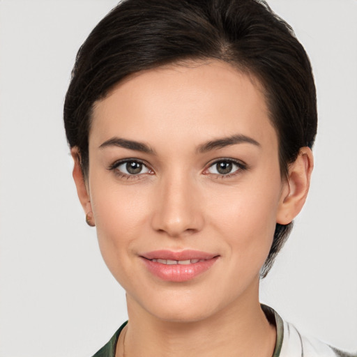 Joyful white young-adult female with medium  brown hair and brown eyes