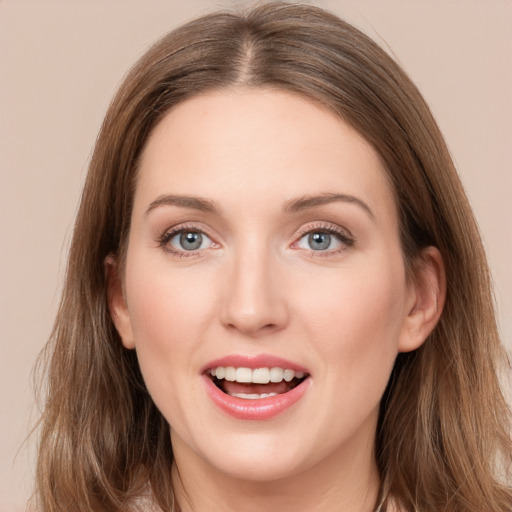 Joyful white young-adult female with long  brown hair and grey eyes