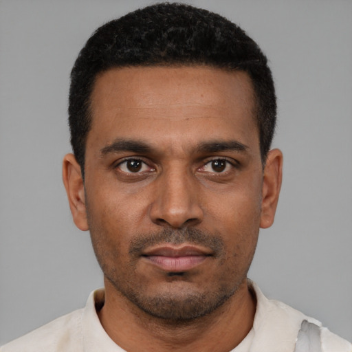 Neutral black young-adult male with short  black hair and brown eyes
