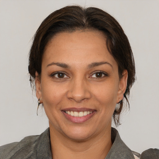 Joyful white adult female with short  brown hair and brown eyes