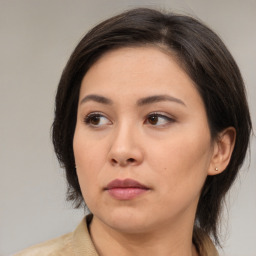 Neutral asian young-adult female with medium  brown hair and brown eyes