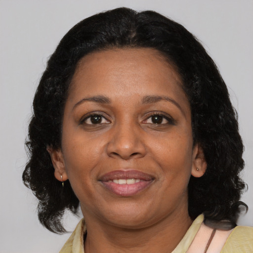 Joyful asian adult female with medium  black hair and brown eyes
