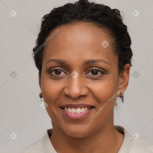 Joyful black young-adult female with short  brown hair and brown eyes