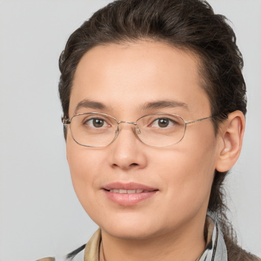 Joyful white adult female with medium  brown hair and brown eyes