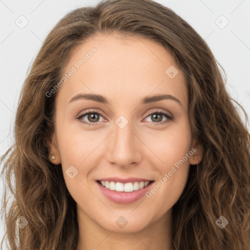 Joyful white young-adult female with long  brown hair and green eyes