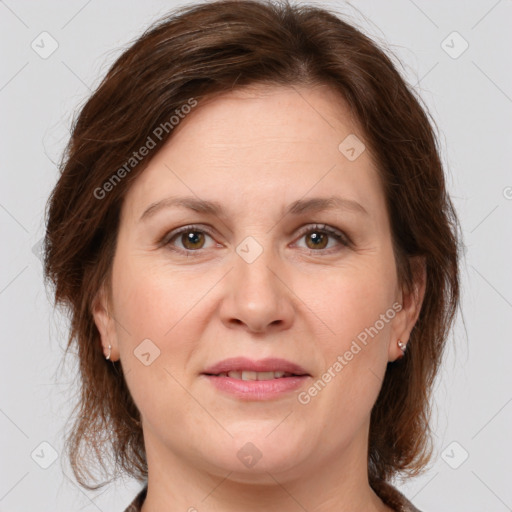 Joyful white adult female with medium  brown hair and brown eyes